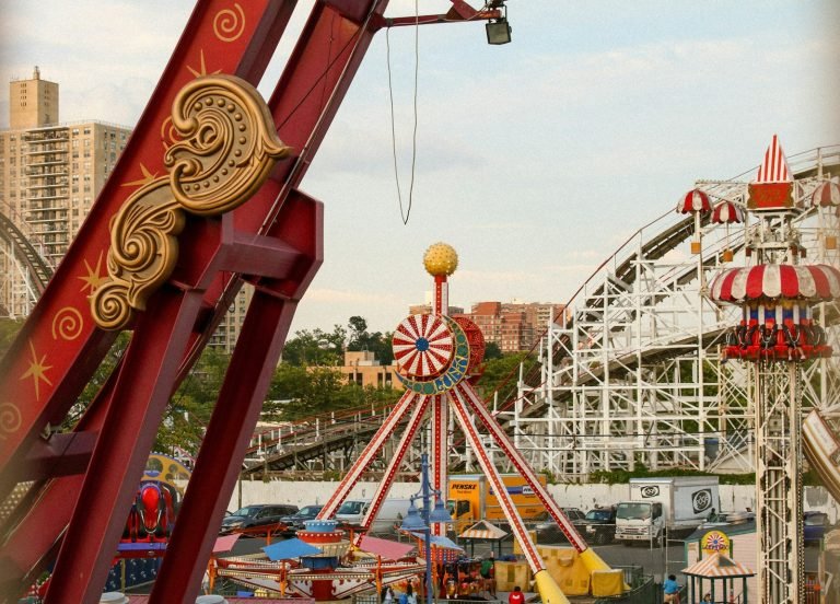 Amusement park rides with a roller coaster