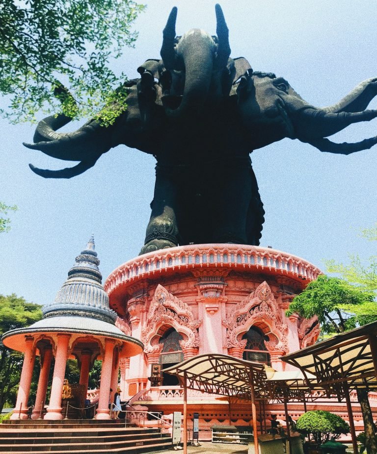 Thai temple among green trees