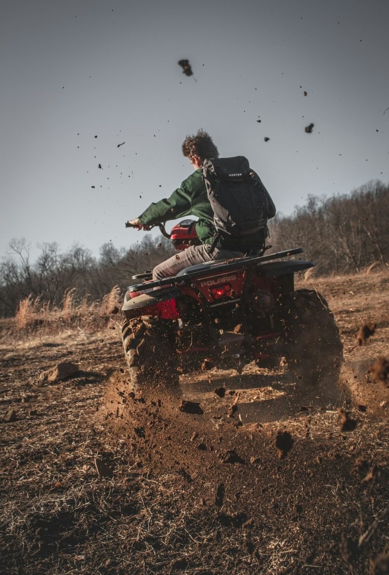 Rider on a red ATV