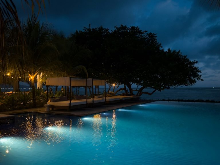 Pool by the ocean at night