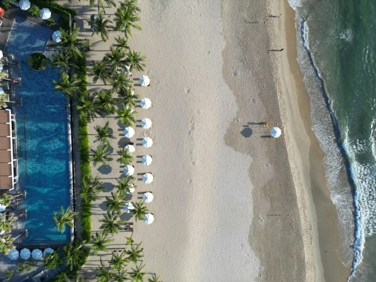 Beach loungers and umbrellas from above
