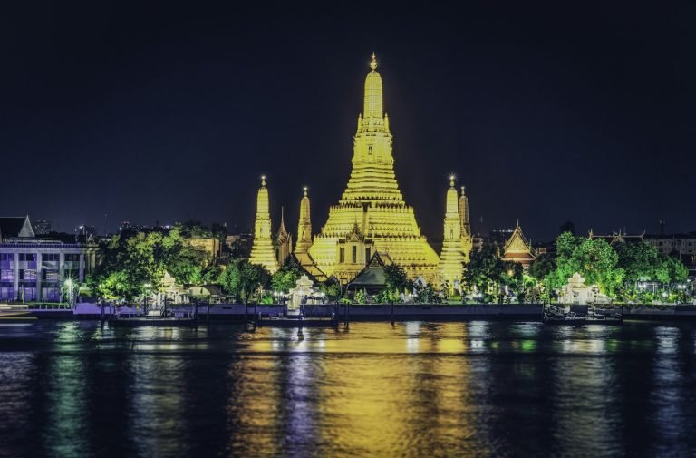 Building by the water at night