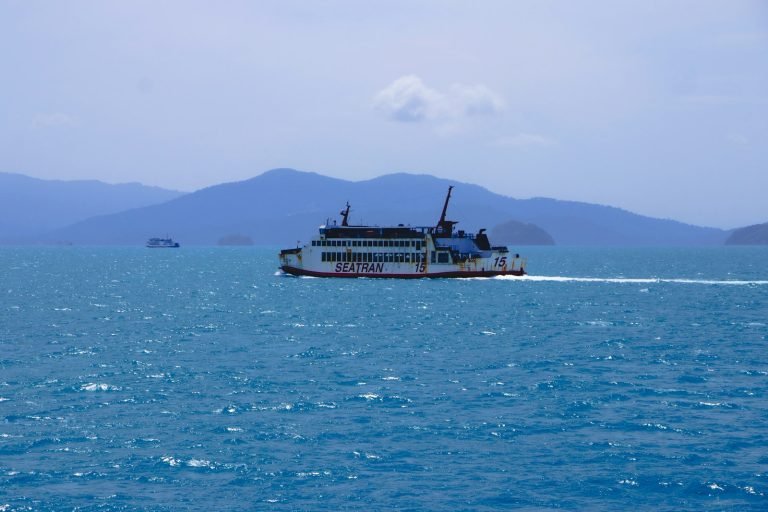 Ferry sailing past the mountains