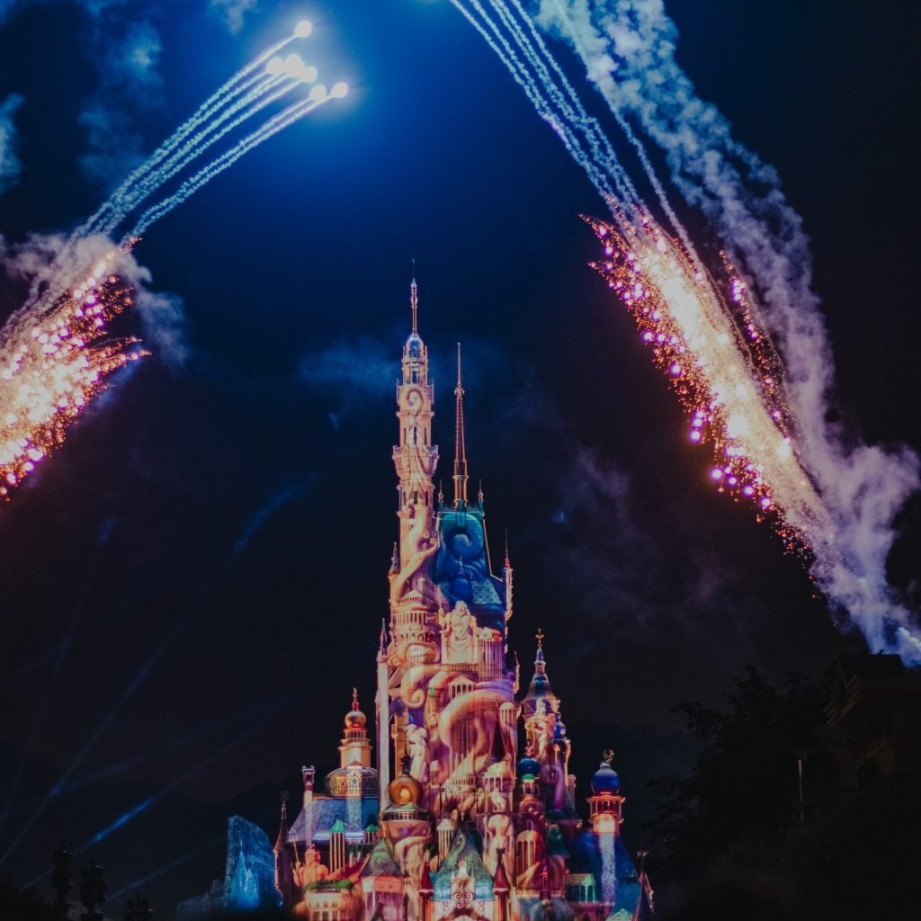 Palace lit up with fireworks at night