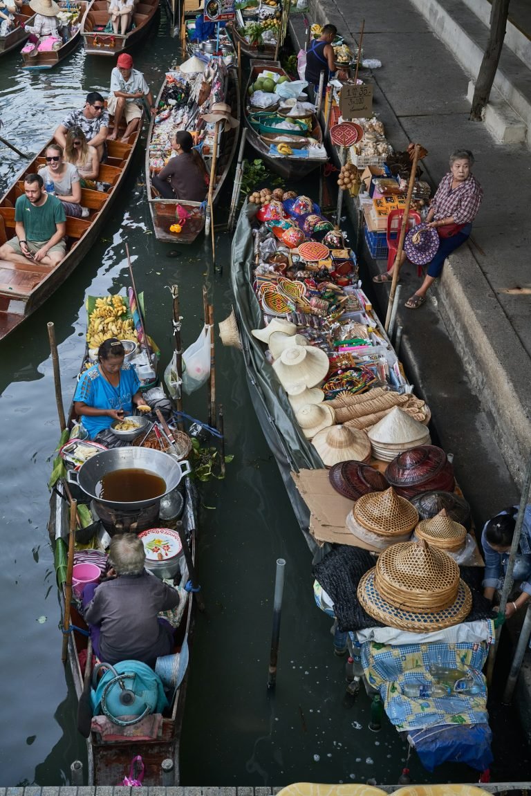 Visitors on boats at a floating market