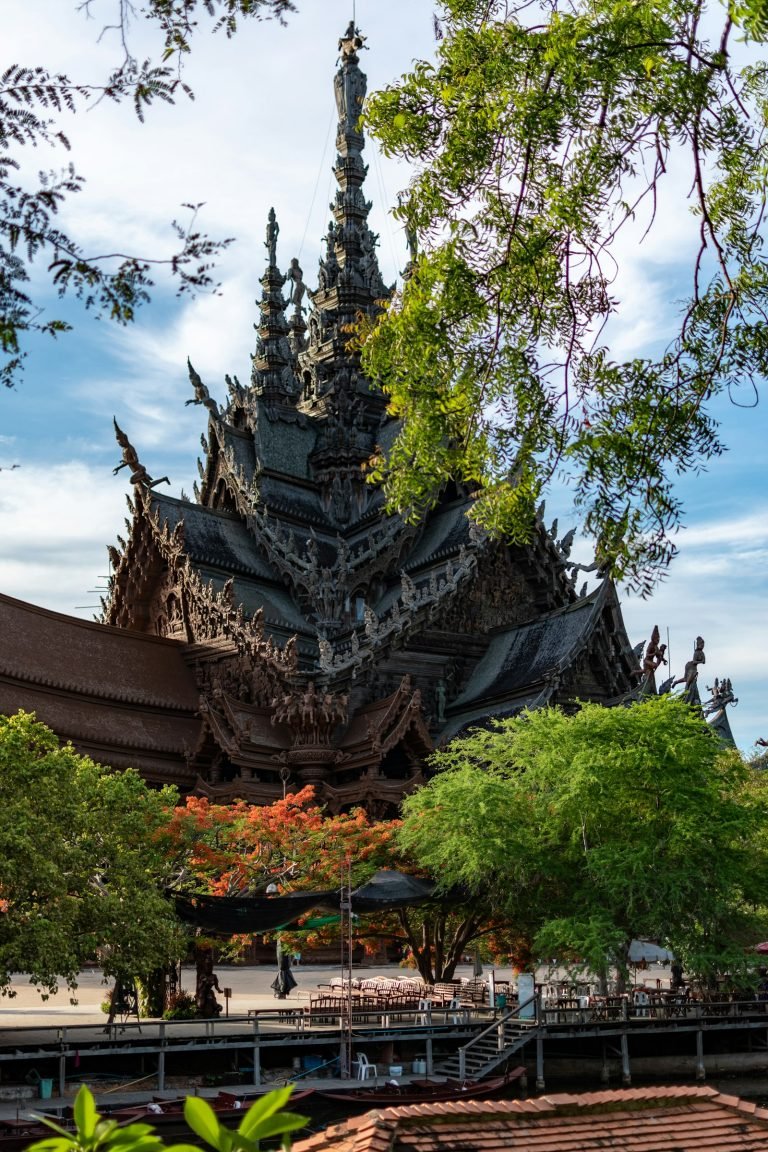 Carved wooden temple under a blue sky