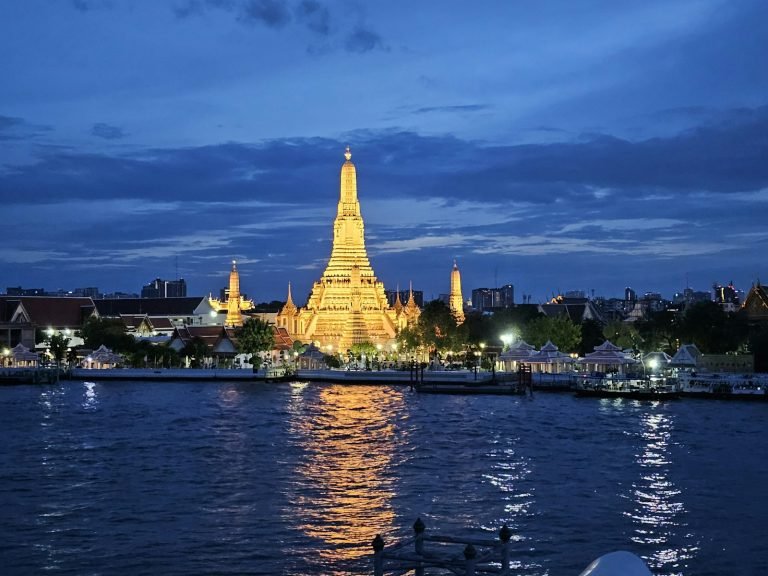 Tower lit up over the river at night