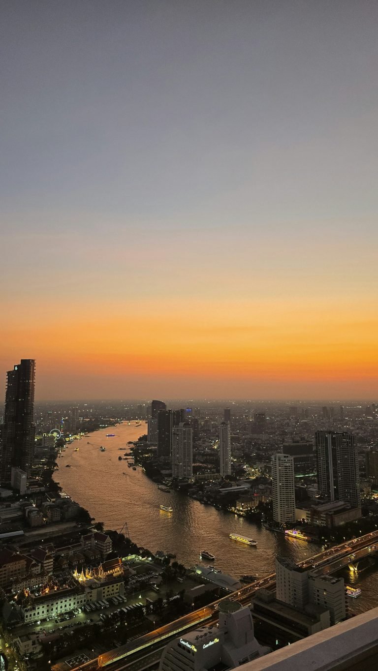 City river under an orange sunset