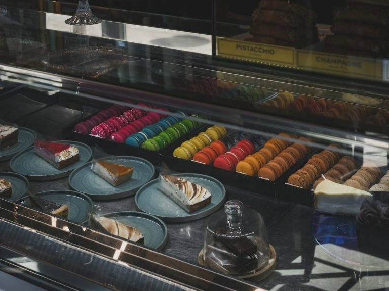 Colourful macarons and cakes in a display