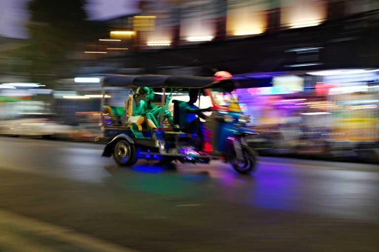 Tuk-tuk ride through lit-up streets