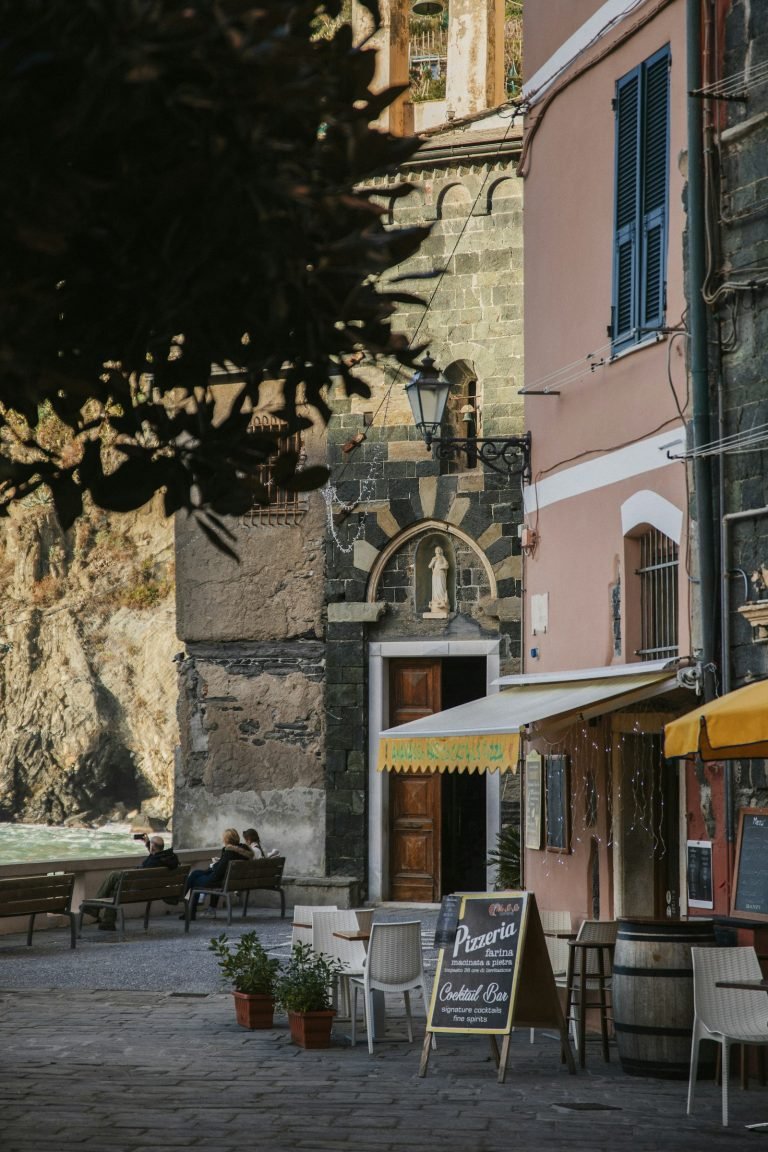 Café tables outside a village building